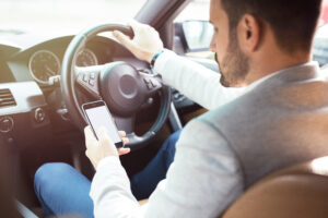 Businessman,Texting,On,His,Mobile,Phone,While,Driving.,Dangerous,Driver.